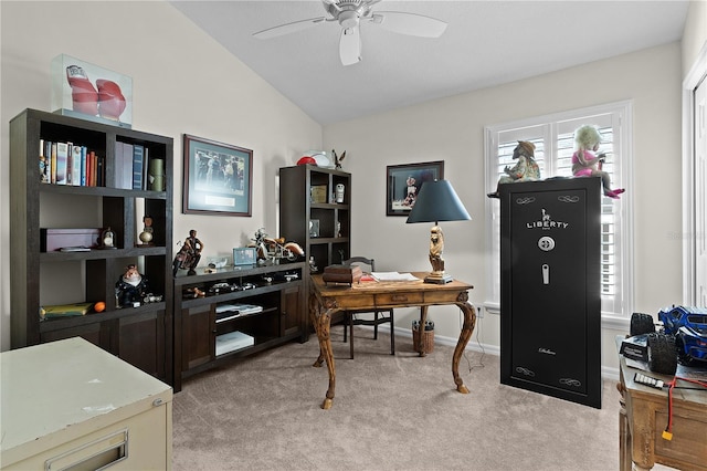 carpeted office featuring vaulted ceiling and ceiling fan