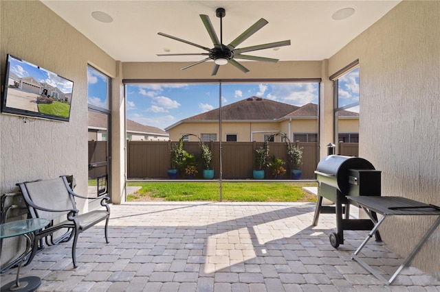 view of patio featuring ceiling fan