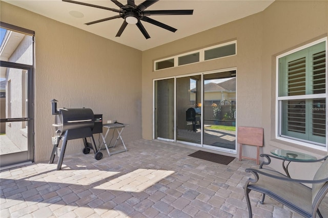 view of patio / terrace featuring a grill and ceiling fan