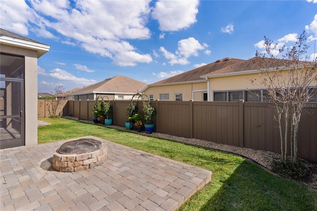 view of patio / terrace with an outdoor fire pit