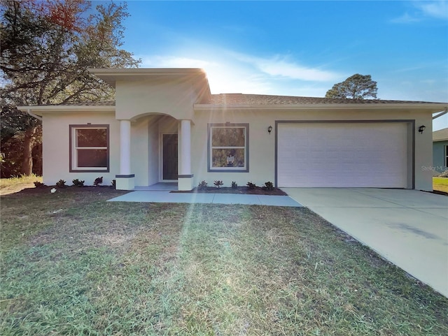 view of front of property with a garage and a front yard