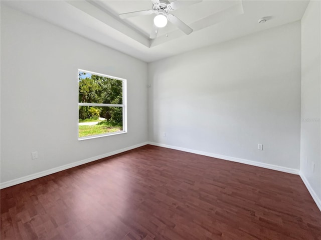 3328 Circleville St, North Port, FL 34286 - empty room with dark wood finished floors, a raised ceiling, and ceiling fan