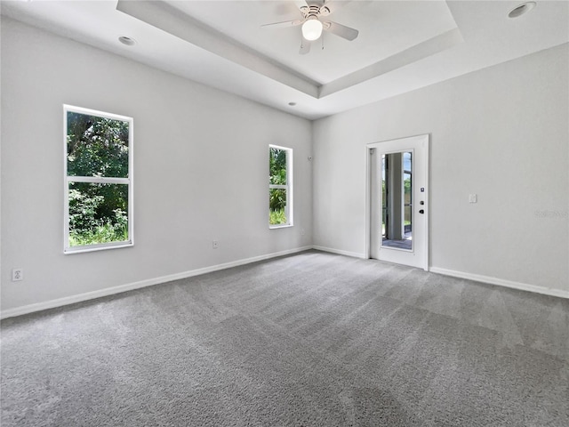 3328 Circleville St, North Port, FL 34286 - carpeted empty room with healthy amount of natural light, ceiling fan, a tray ceiling, and recessed lighting