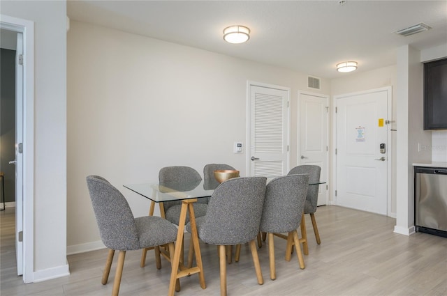 dining area with light hardwood / wood-style floors