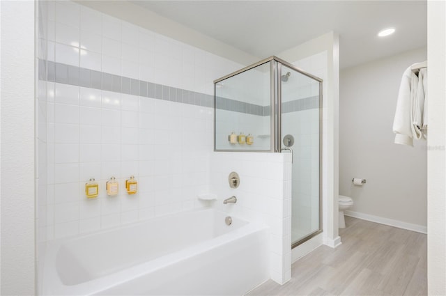 bathroom featuring hardwood / wood-style flooring, independent shower and bath, and toilet