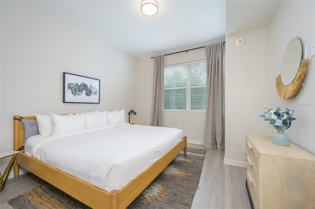 bedroom featuring wood-type flooring