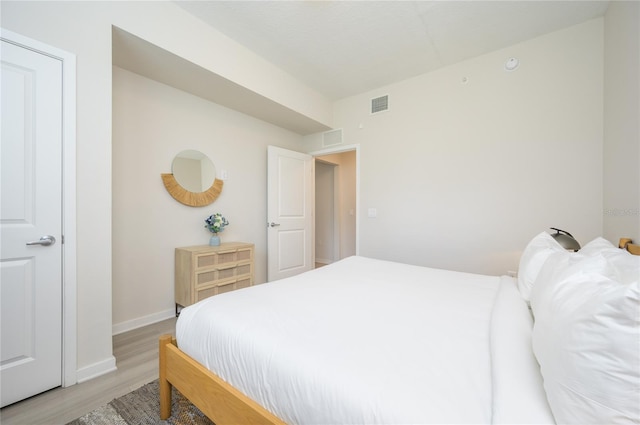 bedroom with light hardwood / wood-style floors