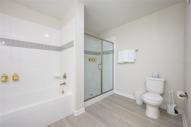 bathroom with toilet and separate shower and tub