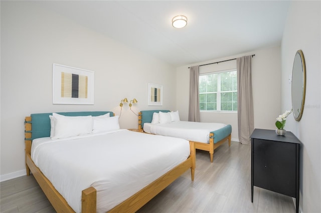 bedroom featuring wood-type flooring