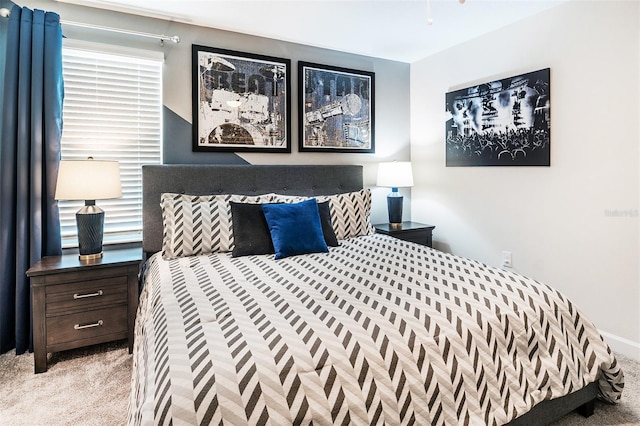 bedroom featuring light carpet