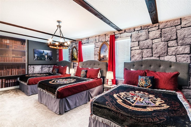 bedroom featuring beamed ceiling, carpet, an inviting chandelier, and a textured ceiling