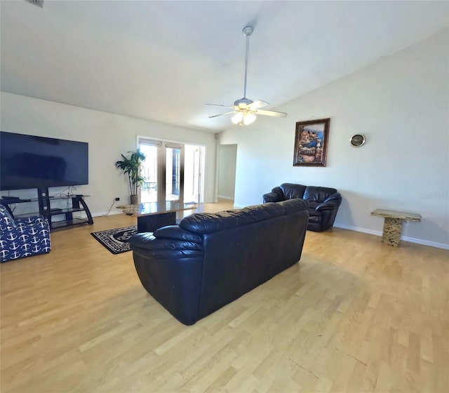 living room with lofted ceiling, light hardwood / wood-style floors, french doors, and ceiling fan