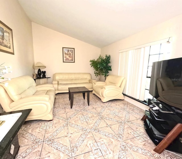 tiled living room with lofted ceiling