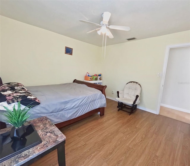 bedroom featuring ceiling fan and light hardwood / wood-style flooring