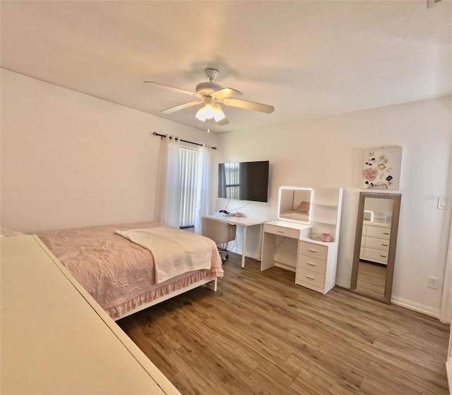 bedroom featuring hardwood / wood-style flooring and ceiling fan