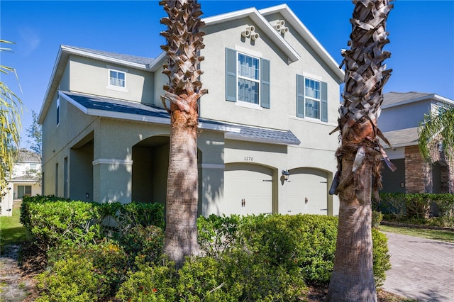 front of property with a garage