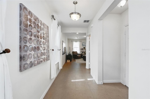 3270 Mt Vernon Way, Kissimmee, FL 34741 - corridor featuring visible vents, baseboards, and light tile patterned floors