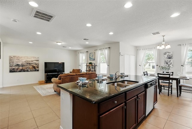 3270 Mt Vernon Way, Kissimmee, FL 34741 - kitchen with a sink, stainless steel dishwasher, light tile patterned flooring, and visible vents