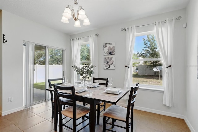 3270 Mt Vernon Way, Kissimmee, FL 34741 - dining space with baseboards, light tile patterned floors, and a notable chandelier