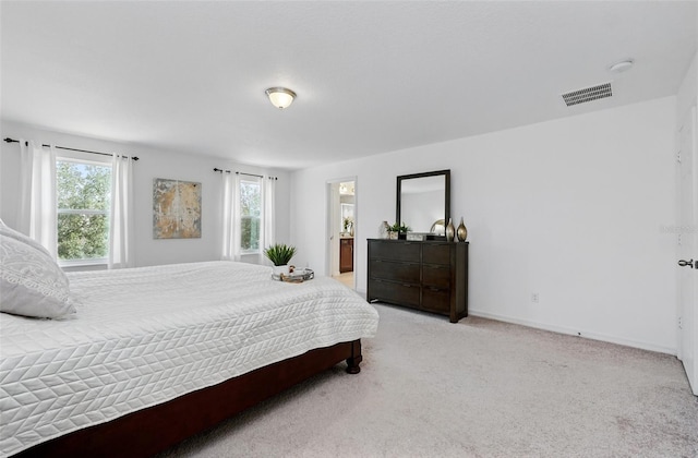 3270 Mt Vernon Way, Kissimmee, FL 34741 - bedroom with connected bathroom, light colored carpet, baseboards, and visible vents