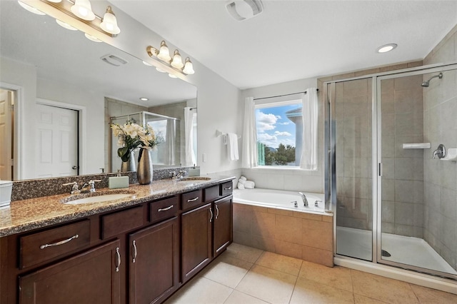 3270 Mt Vernon Way, Kissimmee, FL 34741 - bathroom featuring double vanity, a bath, tile patterned flooring, a stall shower, and a sink