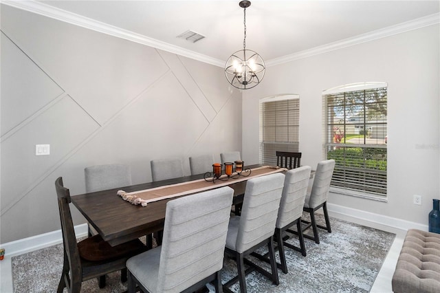 dining space featuring baseboards, visible vents, a chandelier, and crown molding