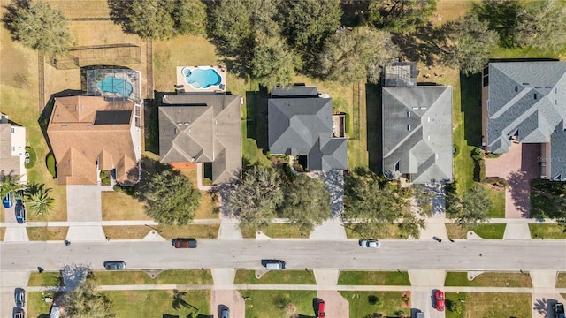 birds eye view of property with a residential view