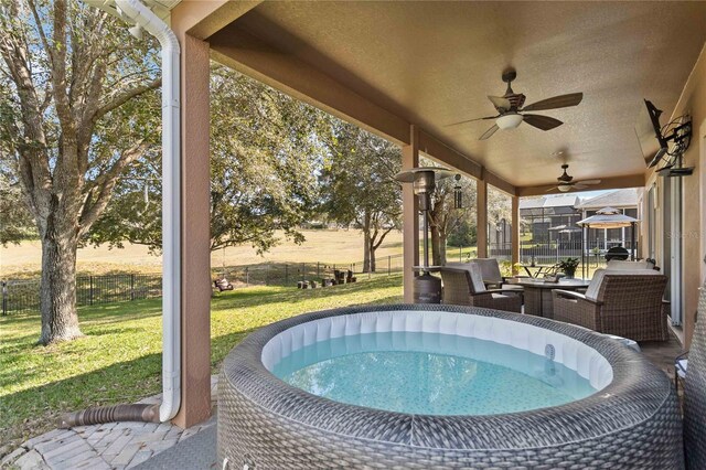 view of swimming pool with a fenced backyard, an outdoor hangout area, ceiling fan, and a yard