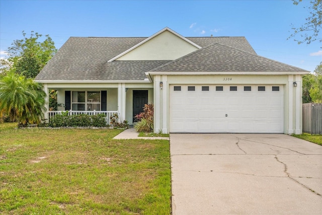 view of front of home featuring an attached garage, a shingled roof, a front lawn, and stucco siding