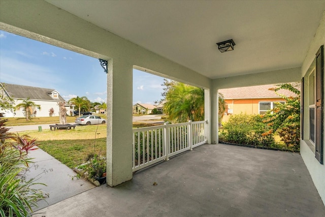 view of patio / terrace featuring a residential view and a porch