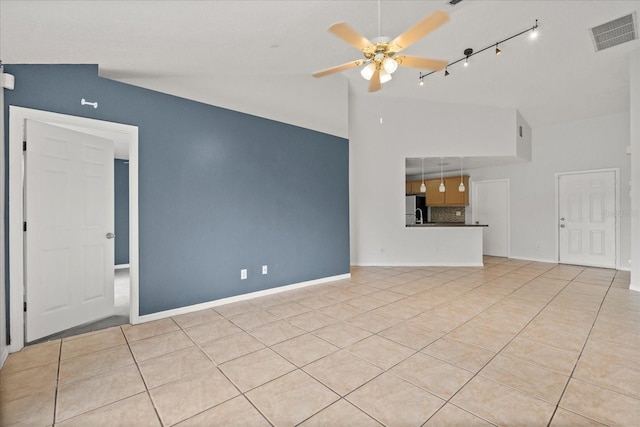 unfurnished living room with light tile patterned flooring, baseboards, visible vents, a ceiling fan, and rail lighting
