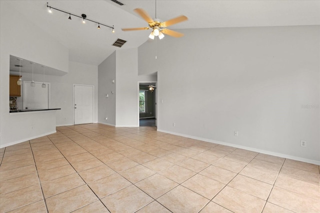 unfurnished living room with high vaulted ceiling, light tile patterned flooring, ceiling fan, rail lighting, and visible vents