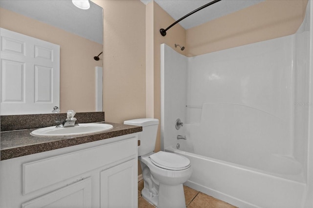 full bath with tile patterned floors, vanity, shower / tub combination, and toilet