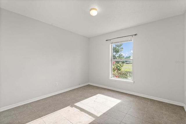 tiled spare room with baseboards
