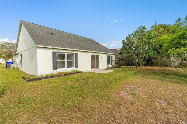 3304 Kelsey Ln, Saint Cloud, FL 34772 - back of house featuring a shingled roof and stucco siding