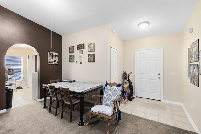 dining room with light colored carpet