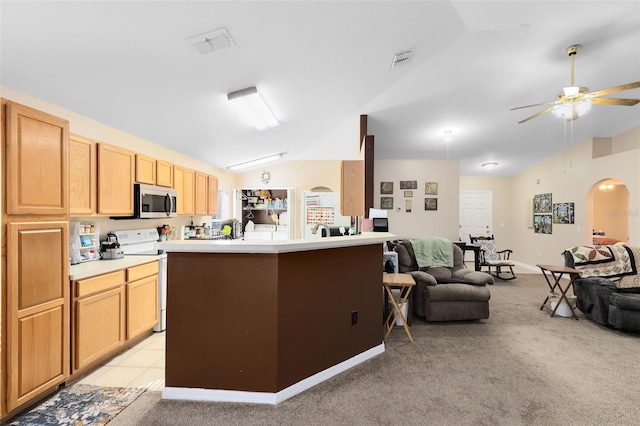 kitchen featuring light carpet, vaulted ceiling, ceiling fan, and white range with electric cooktop