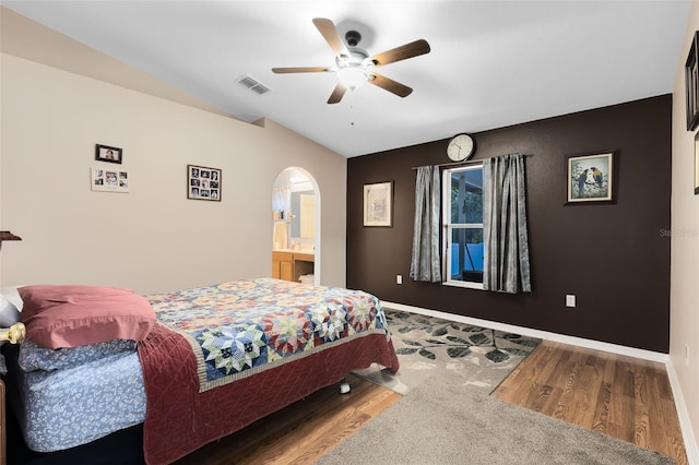 bedroom with ceiling fan, wood-type flooring, and vaulted ceiling