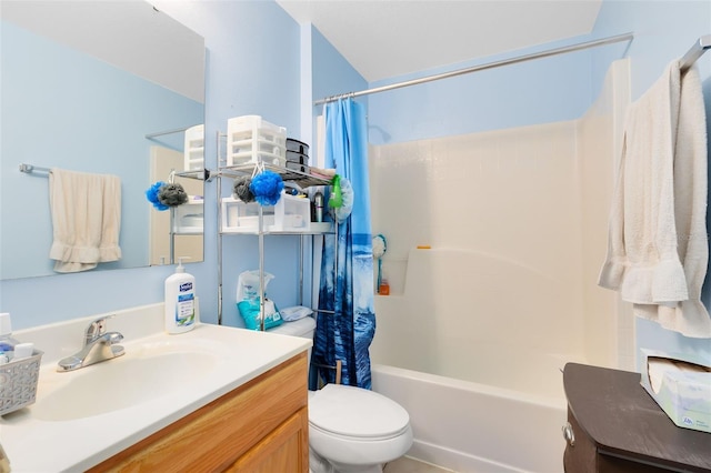 full bathroom with vanity, shower / tub combo, and toilet