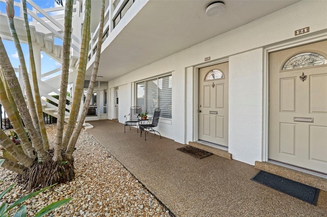 doorway to property with a porch