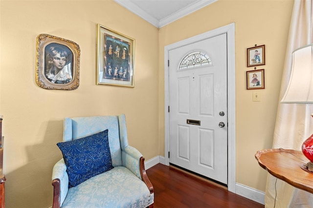 entrance foyer with dark hardwood / wood-style flooring and crown molding