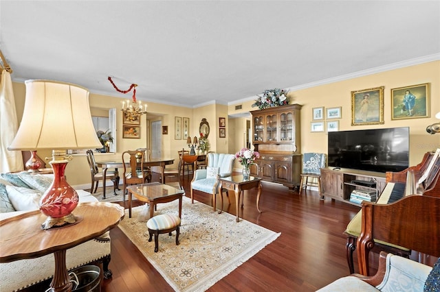 living room with crown molding, dark wood-type flooring, and a chandelier