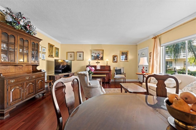 dining room featuring ornamental molding, dark hardwood / wood-style floors, and a textured ceiling