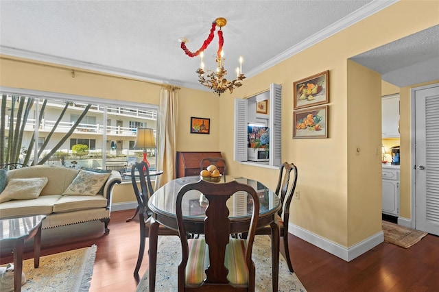 dining room with crown molding, a chandelier, hardwood / wood-style floors, and a textured ceiling