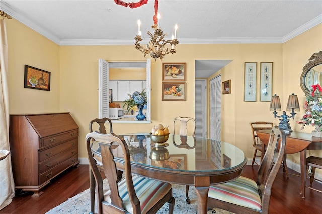 dining room featuring ornamental molding, dark hardwood / wood-style floors, and a chandelier