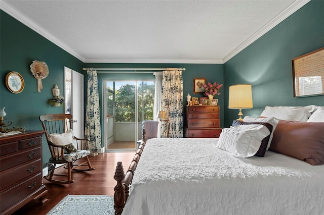 bedroom featuring dark hardwood / wood-style flooring, access to outside, ornamental molding, and a textured ceiling