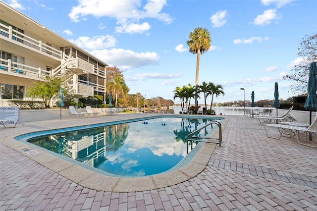 view of swimming pool with a patio