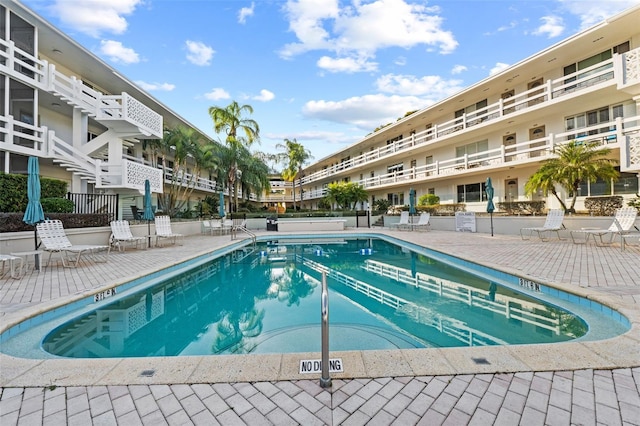 view of swimming pool with a patio area