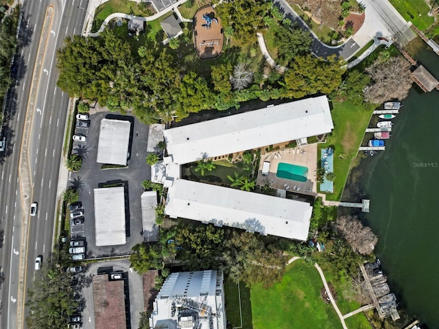 birds eye view of property with a water view