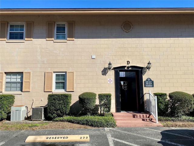 entrance to property with central AC unit